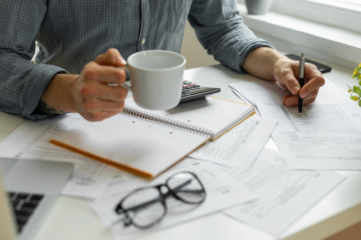 Professional business man is working on legal reports. Close-up of a man's hands as he works.